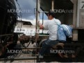 A migrant runs to catch a northbound train leaving the Tultitlan railyard.